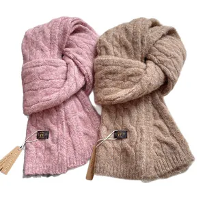 Thick wool cable knit winter scarves in pink and camel with soft warm texture