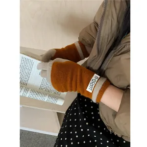 Knitted pumpkin orange and beige touchscreen gloves with stylish logo patch for winter