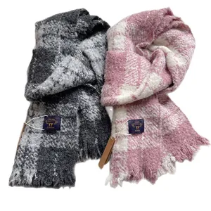 Thick plaid winter scarf in grey and pink options with tassels and soft fabric