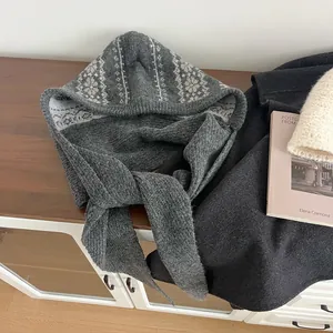 Close-up of Fair Isle knit balaclava hood in dark grey with Nordic geometric patterns