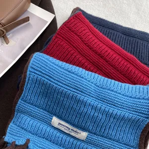 Japanese style solid color chunky knit scarves in blue, red, and navy with contrast edges