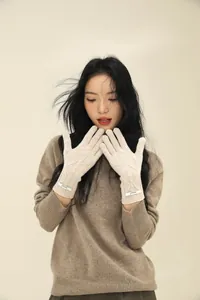 Detailed knit texture and brand label on a soft merino wool touchscreen glove
