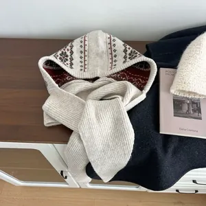 Close-up of Fair Isle knit balaclava with vintage floral patterns and thick ribbed texture