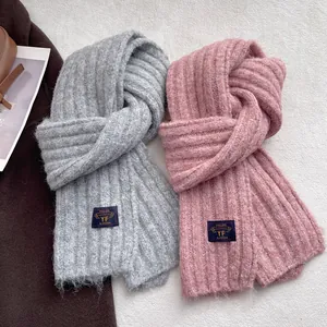 Thick ribbed knit scarf for winter in gray and pink with premium brand label detail
