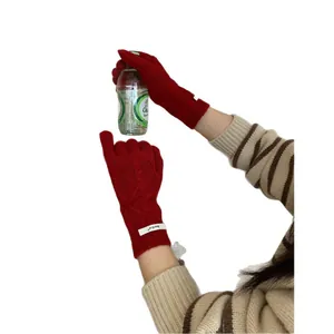 Red merino wool knitted gloves with touch screen design and classic cable pattern