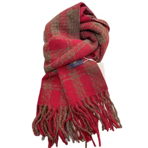 Thick red and brown plaid scarf with long fringe tassels and woven brand label