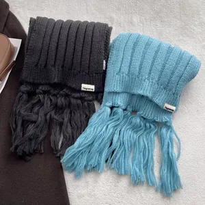 Thick knitted Iceland blue and dark grey scarves with long tassels for winter warmth