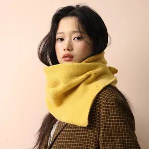 Knitted mustard yellow cable knit scarf button wrap shown on a model in autumn style