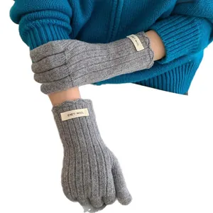 Classic dark grey wool knit gloves for women featuring ribbed texture and touchscreen tips