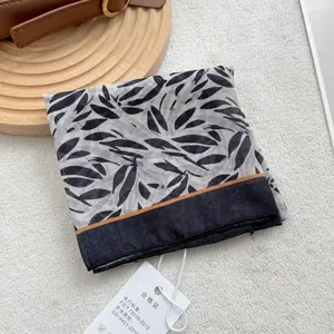 Cotton linen square scarf with monochrome leaf print and yellow border accent