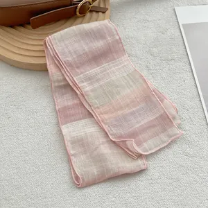 Close-up of pure linen scarf showing soft pink gradient and delicate mesh texture