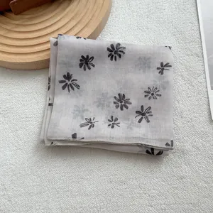 Retro linen-feel small square scarf with black daisy print on soft beige fabric
