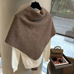 Detailed knit texture of heavy wool triangle shawl in dark brown finish