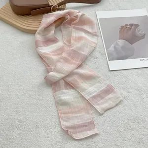 Macro detail of high-quality pure linen scarf with soft gradient stripes and fine stitching