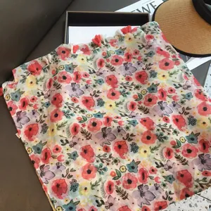 Red floral silk scarf with tassels and colorful print for beach sun protection