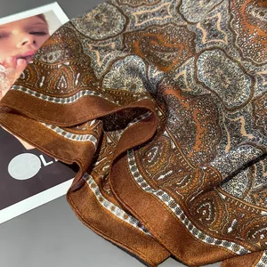 Brown paisley silk shawl with vintage floral patterns and smooth draped texture
