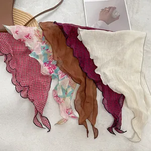 Set of five linen triangular scarves in plaid and floral patterns with wavy edges
