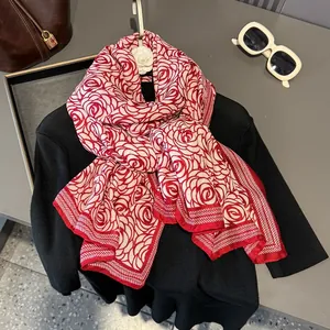 Women's silk scarf with red rose floral pattern and geometric border for summer sun protection