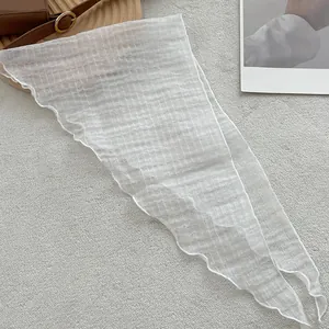Lightweight white linen triangle scarf with textured square patterns for summer wear