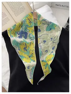 Detail of French vintage floral scarf with bright blue and yellow abstract patterns