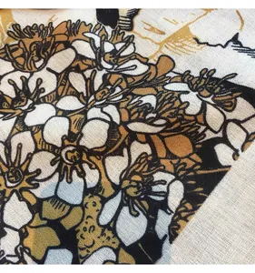 Macro detail of retro floral pattern on soft cotton linen square scarf fabric