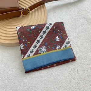 Vintage floral cotton linen square scarf with blue and yellow border on white rug