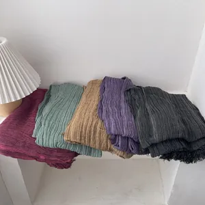 Pleated cotton linen shawl in various solid colors with wrinkled texture and fringe edge
