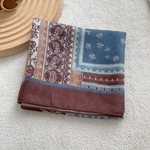 Detail of vintage paisley cotton-linen scarf showing intricate floral patterns and textures