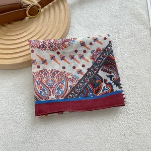 Macro shot of vintage paisley print cotton linen scarf with ethnic floral patterns
