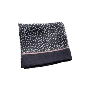 Fashionable leopard print square scarf in black and white with a pink stripe accent
