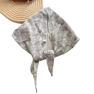 Floral print cotton linen triangular headscarf in beige with black flower patterns