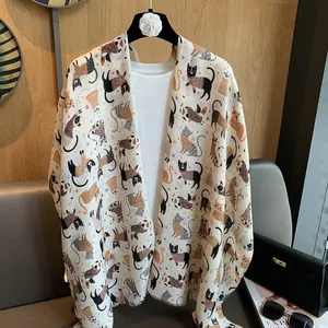 Chic cream cotton scarf with colorful cartoon cat print and soft frayed edges