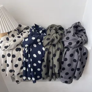 French vintage polka dot scarves in four colors shown with minimalist lamp decor