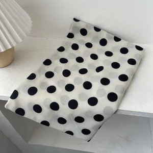 Elegant retro French style scarf with black polka dots on cream white fabric