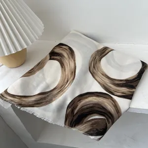 Cream white scarf with brown interlocking circle patterns and delicate fringe borders