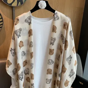 Beige cotton linen shawl featuring cute cartoon teddy bear prints for summer travel