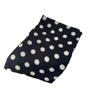 Elegant retro black and white polka dot scarf made of soft knitted warm fabric
