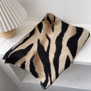 Elegant zebra pattern winter scarf for women in warm beige and black plush fabric