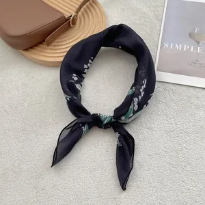 Navy blue linen-silk scarf with white lily of the valley floral print in elegant knot style