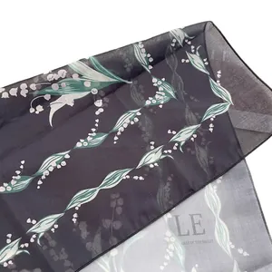 Elegant cotton linen scarf with lily of the valley floral print on charcoal grey fabric