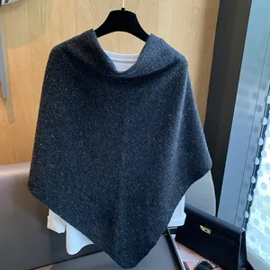 Detailed knit texture of dark grey 100% wool triangle shawl with white flecks