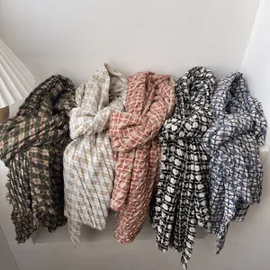 Plaid knitted long scarves with fringed edges in olive, beige, and caramel tones