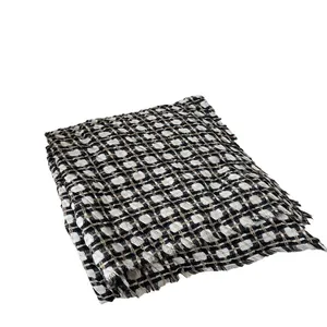 Classic checkered knit scarf with fringe trim in black, white and brown colors