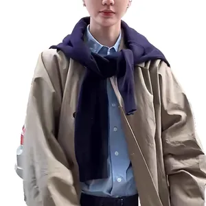 Men's khaki hooded trench coat with light blue shirt and navy knit shawl drape