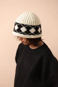 Close-up of Nordic vintage argyle pattern on a thick 100% wool knitted bucket hat for winter