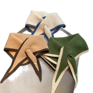 Three knitted triangle scarves in beige, camel and green with stylish metal buckle detail
