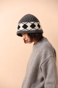 Close-up of a thick 100% wool knitted bucket hat with a vintage argyle pattern band