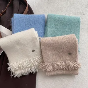 Winter wool blend knit tassel scarf for women in cream, blue, and mint green colors