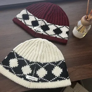 Detail of 100% wool knit bucket hat with Nordic geometric pattern and thick texture