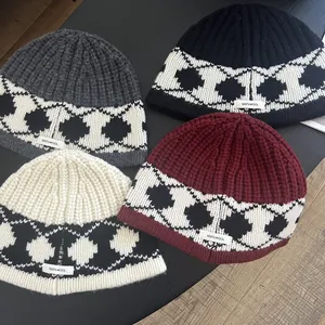 Detailed knit texture of 100% wool beanies featuring Nordic geometric diamond patterns